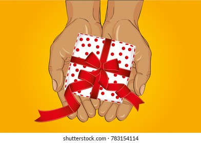 Hands stretch a gift box with a bow. View from above. Greeting card or invitation for the holiday.