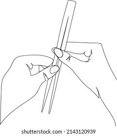 hands with sushi sticks. tableware. sushi sticks