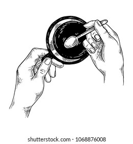 Hands with teaspoon and tea cup engraving vector illustration. Scratch board style imitation. Black and white hand drawn image.