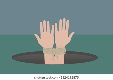 hands tied and trapped in hole