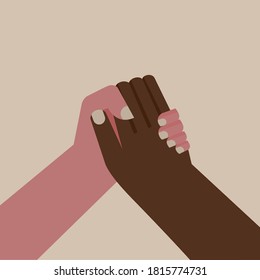 Hands of two different ethnicity holding together
