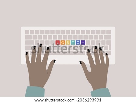 Hands typing on a keyboard, top view, rainbow buttons with an LGBTQ+ sign, queer community support
