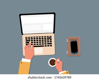 Hands typing text on the laptop keyboard and using social networks for communication. Top view of people working with computer at the work desk