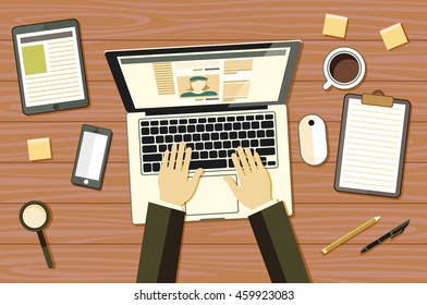 hands typing text on the laptop keyboard and using social networks for communication. Top view of people working with computer at the work desk art vector