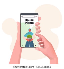 hands using digital device arab woman planting houseplants in pot on smartphone screen horticulture concept portrait copy space vector illustration