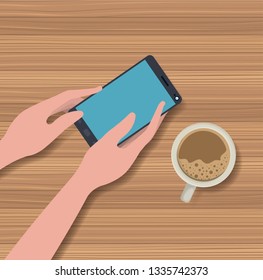 hands using smartphone with coffee cup in the table