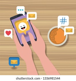 hands using smartphone with coffee cup and social icons