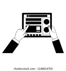 Hands using tablet to check social networks in black and white