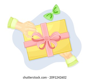 Hands wrapping gift box. Top view of creative work process, hobby and craft concept vector illustration