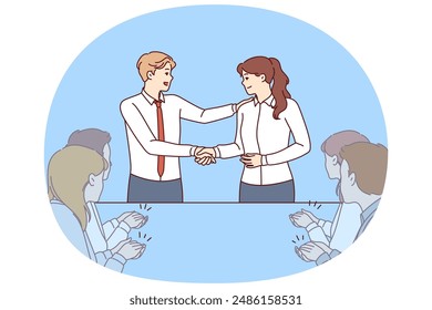 Handshake of boss and new employee of company during business meeting with colleagues. Man boss shakes hands with employee who has successfully completed complex project or attracted most customers