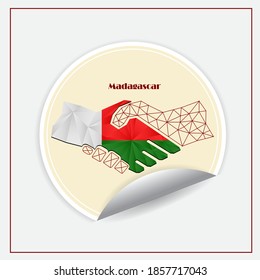 Logo del apretón de manos hecho con la bandera de Madagascar