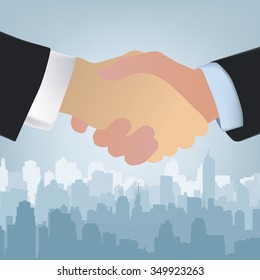 Handshake silhouette. City background