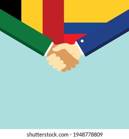 El apretón de manos y dos banderas Bélgica y Colombia. Ilustración vectorial de estilo plano.