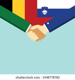 The handshake and two flags Belgium and Slovenia. Flat style vector illustration.
