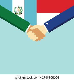 The handshake and two flags Guatemala and Indonesia. Flat style vector illustration.