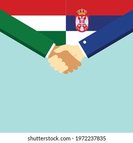 The handshake and two flags Hungary and Serbia. Flat style vector illustration.