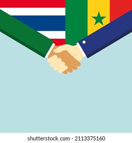 El apretón de manos y dos banderas: Tailandia y Senegal. Ilustración