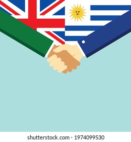 The handshake and two flags United Kingdom and Uruguay. Flat style vector illustration.