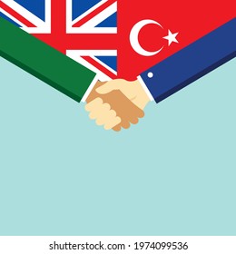 The handshake and two flags United Kingdom and Turkey. Flat style vector illustration.