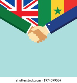 The handshake and two flags United Kingdom and Senegal. Flat style vector illustration.
