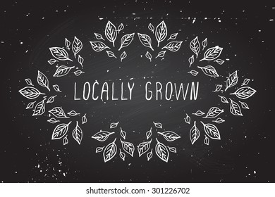 Hand-sketched frame on chalkboard background. Locally grown