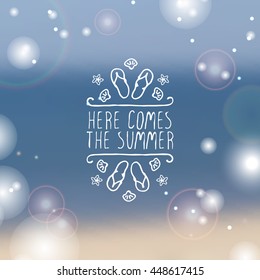 Hand-sketched summer element with flip flops and starfish on blurred background. Text - Here comes the summer