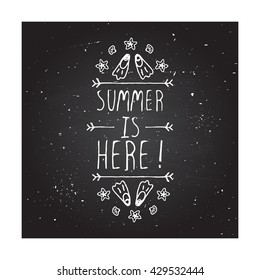 Hand-sketched summer element with flippers and starfish on blackboard background. Text - Summer is here