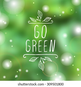 Hand-sketched typographic element. Go green - product label on blurred background. Suitable for ads, signboards, packaging and identity and web designs.
