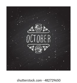 Hand-sketched typographic element with jam, berries and text on blackboard background.