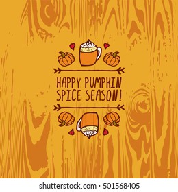 Hand-sketched typographic element with pumpkins, hearts, pumpkin spice latte and text on wooden background. Happy pumpkin spice season