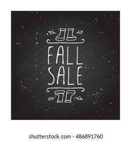 Hand-sketched typographic element with rubber boots, leaves and text on blackboard background. Fall sale