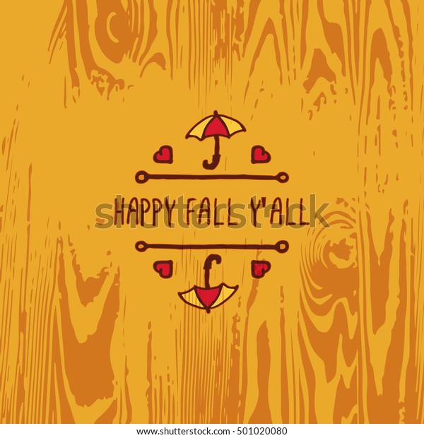 Hand-sketched typographic\
element with umbrella, hearts and text on wooden background. Happy\
fall you all