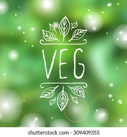 Hand-sketched typographic element.  Veg - product label on blurred background. Suitable for ads, signboards, packaging and identity and web designs.
