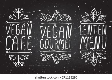 Hand-sketched typographic elements on chalkboard background. Vegan cafe. Vegan gourmet. Lenten menu. Restaurant labels. Suitable for ads, signboards, menu and web banner designs