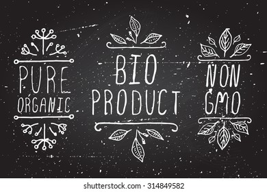 Hand-sketched typographic elements. Organic product labels on chalkboard background. Pure organic. Bio product. Non GMO.