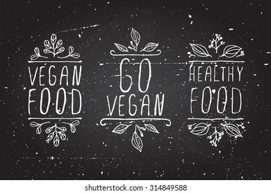Hand-sketched typographic elements. Vegan product labels on chalkboard background. Vegan food, go vegan, healthy food