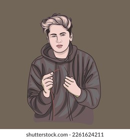 a handsome boy tries to thread a needle