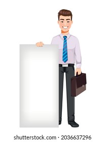 Handsome business man standing near blank placard