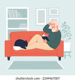 Handsome elderly man sitting on sofa and reading a book