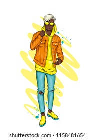 Handsome guy in stylish clothes. Hipster. Vector illustration.