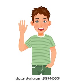 Handsome happy young man with hand in the pocket, smiling, waving hand cheerfully saying hi, hello nice to meet you, welcoming people with informal greeting gesture