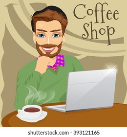 handsome hipster man with laptop in coffee shop
