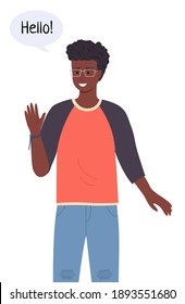 Handsome and intelligent black or ethnic teenage boy or young man with glasses. Smiling african american student talking Hello in chat bubble. Friendly male character waving a greeting welcome gesture