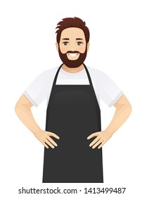 Handsome man in black apron standing isolated vector illustration