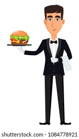 Handsome waiter wearing a professional uniform. Cheerful cartoon character holding tasty hamburger. Restaurant staff. Vector illustration.