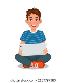 handsome young man sitting on the floor while using a digital smart tablet device for reading news, browsing Internet, watching videos and checking social networks