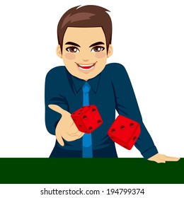 Handsome young man throwing dice gambling playing craps on green table