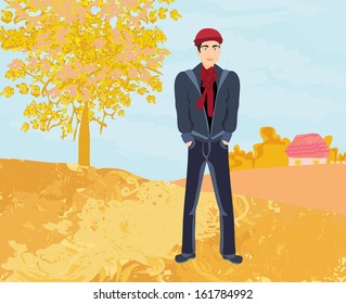 Handsome young man walking in autumn day 