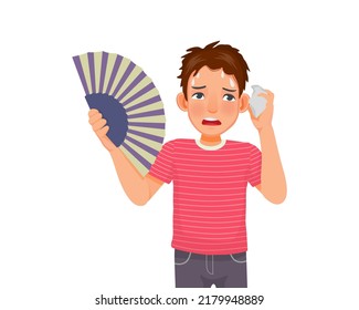 handsome young woman suffering heat wave stroke in very hot weather using hand fan and tissue to dry sweat