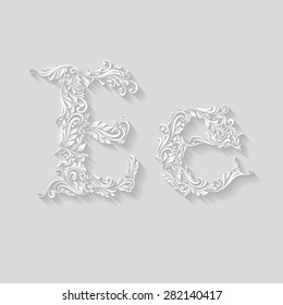 Handsomely decorated letter E in upper and lower case on gray